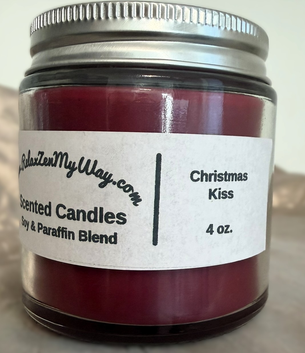 4 oz jar with silver lid; Christmas Kiss